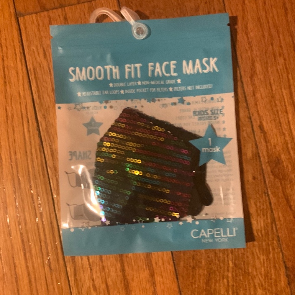 A rainbow shiny kids face mask with sequence.